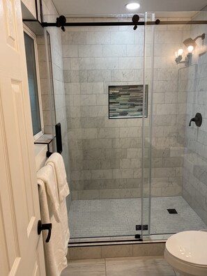 Shower, hair dryer, towels, soap