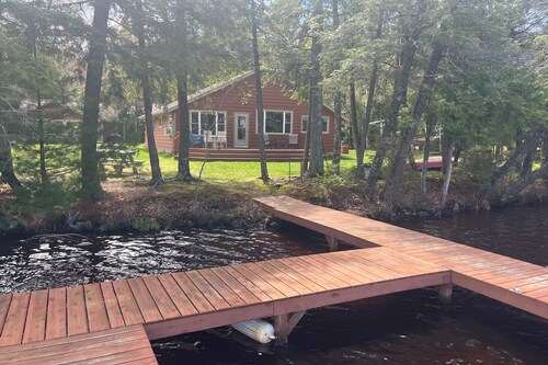 Dog-friendly lakefront cottage with private dock, firepit, grill & washer/dryer