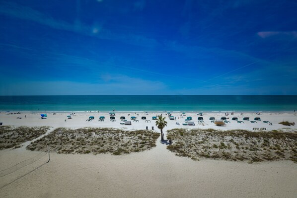 On the beach, sun-loungers, beach towels
