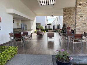 Relax in our outdoor patio area, featuring comfortable seating and a, open space.