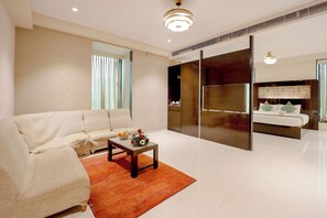 Junior Suite, 2 Queen Beds | Living area | 32-inch TV with cable channels