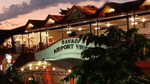 A building with a sign reading "DAVAO AIRPORT VIEW". - Davao Airport View Hotel (Davao)