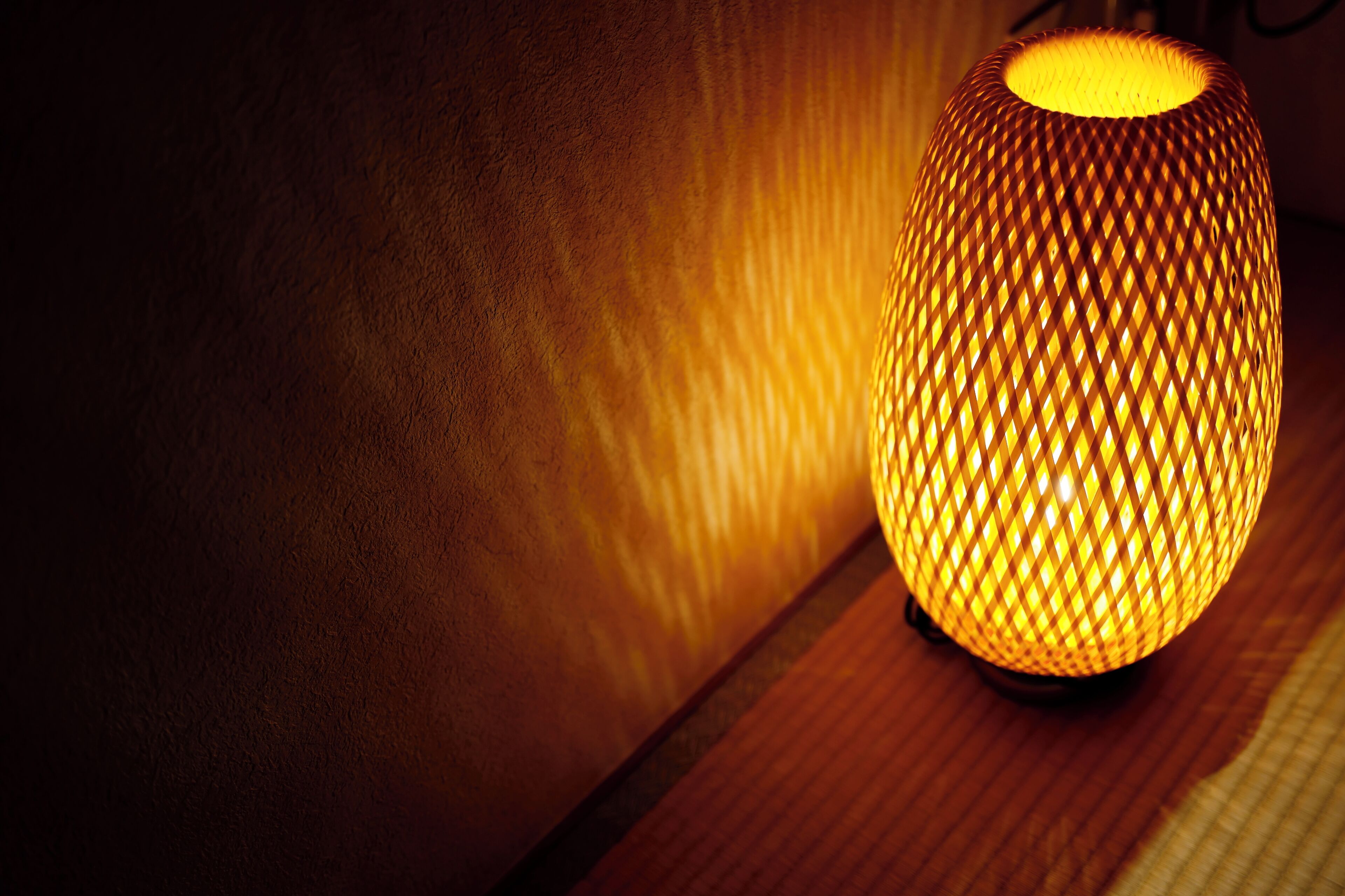 A spherical lamp with a textured surface, casting a warm glow.
