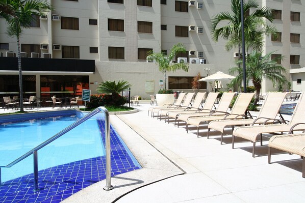 Outdoor pool, pool umbrellas, sun loungers