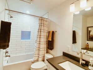 Shower, hair dryer, towels, soap