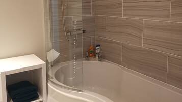 Combined shower/bathtub, hair dryer, towels, soap