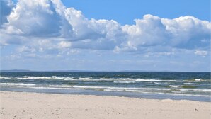 A beach with waves and a clear sky. - Pet friendly home in Jezierzany with sauna (Jezierzany)