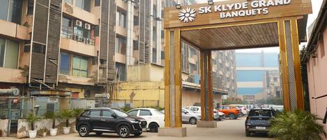 A building entrance with a sign reading "SK KLYDE GRAND BANQUETS".