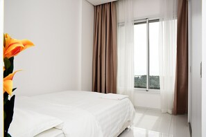 Familienapartment, Meerblick | 2 Schlafzimmer, Minibar, Bügeleisen/Bügelbrett, Babybetten