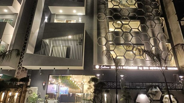 A modern building with a hexagonal facade and multiple balconies. - Culture by BVH Hospitality Greater Noida (Greater Noida)