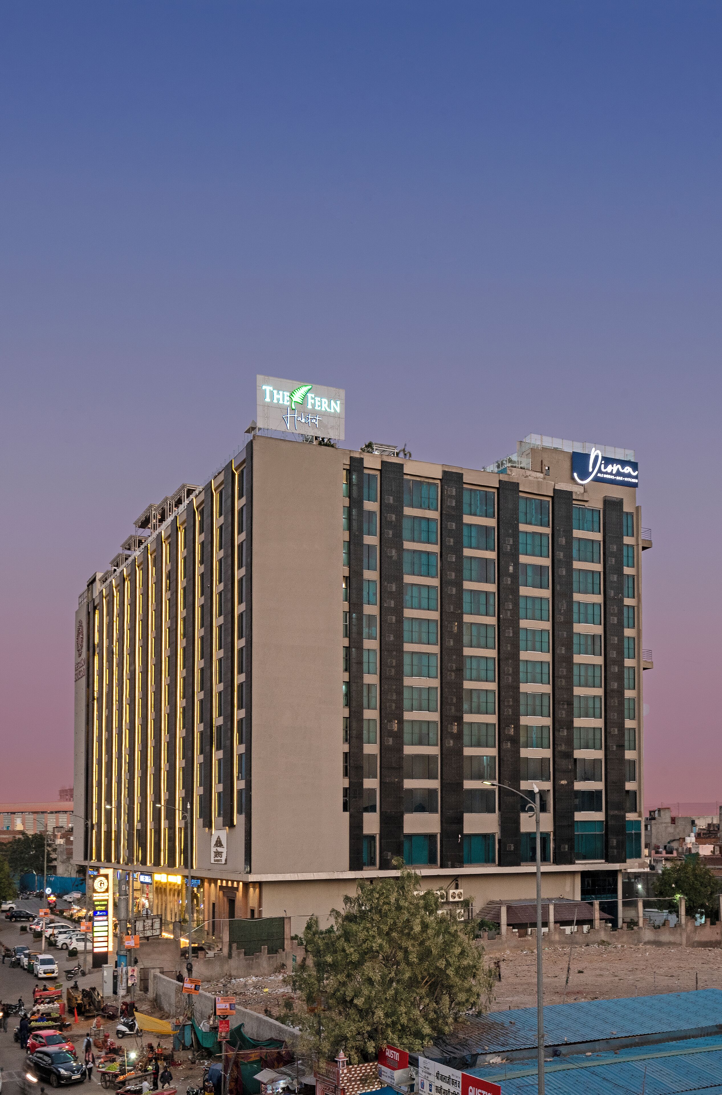 A multi-story hotel with a prominent sign for 'The Fern' and 'Viva'.