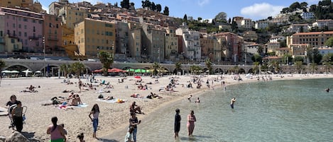 On the beach, sun-loungers