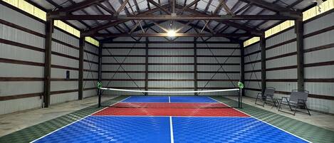 Bring everyone together in your private indoor Pickleball court! Complete with sports court, nets for volleyball or badminton, racquets and balls, and team benches!  