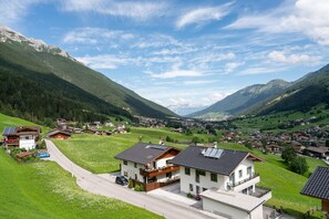 A residential area with houses, a road, and mountains in the background. - Apartment in Neustift Near Ski Lift (Neustift Im Stubaital)