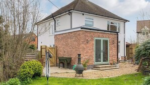 A two-story house with a brick facade and a tiled roof. - 3 bedroom accommodation in Rugby (Rugby)