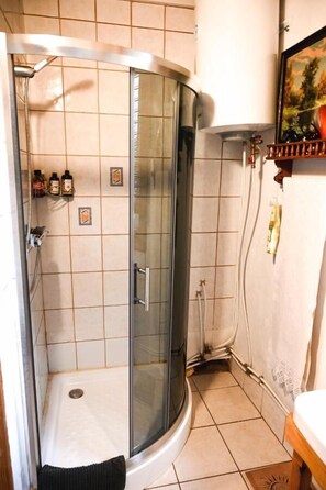 Family House | Bathroom | Shower, designer toiletries, hair dryer, bathrobes