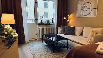 Apartamento, 1 quarto, vista para a cidade | Área de estar