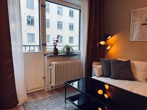Departamento, 1 habitación, vista a la ciudad | Área de sala de estar