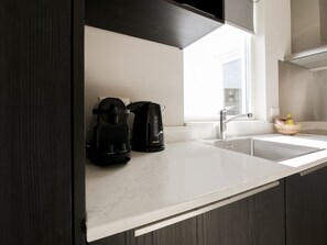 Apartamento | Cozinha privada | Micro-ondas, cadeirão de bebê