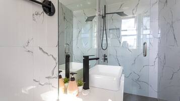 Shower, hair dryer, towels, soap