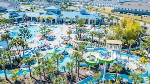 An aerial view of a resort with multiple swimming pools, water slides, and palm trees. - Special Offer- 10BR/8BA Windsor Island, Private pool 2017LC (Davenport)