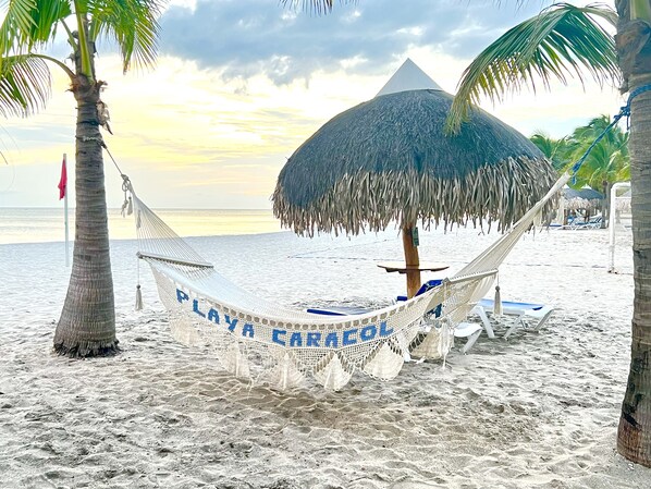 Private beach, beach umbrellas, windsurfing, 2 beach bars