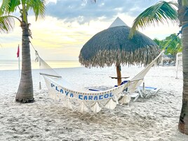 Private beach, beach umbrellas, windsurfing, 2 beach bars