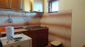 A compact kitchen with a sink, stove, and cabinets. - Nar Apartment A4 - With sea View Terrace (Pasman)