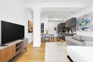 Premium One-Bedroom with Sofa Bed | Living area | 55-inch Smart TV with digital channels, TV, Netflix - Bakan - Quartier des Congres (Montreal)