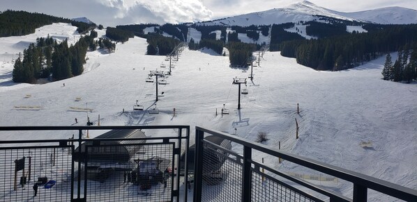 A ski resort with a chairlift, snow-covered slopes, and a mountain in the background. - SPRING BREAK- SLOPESIDE Luxury Ski-in/Ski-out- Grand Colorado Peak 8 - SLEEPS 16 (Breckenridge)