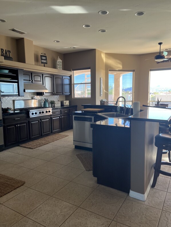 Fridge, microwave, oven, cookware/dishes/utensils