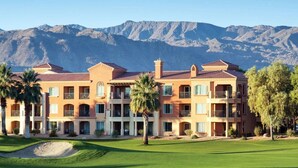 A multi-story hotel with balconies, set against a mountainous backdrop. - Coachella 2026! Marriott Shadow Ridge Enclave- First Weekend (Palm Desert)