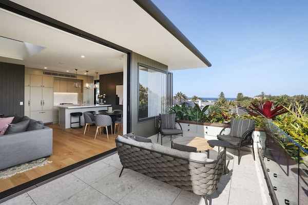 Oversized balcony with table and chairs up the opposite end