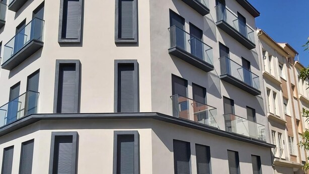 A modern multi-story building with balconies and large windows. - Large central apartment in Malaga for 4, ideal for family or couple (Málaga)