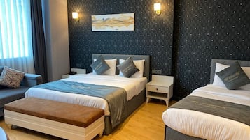 Suite familiar | 2 habitaciones, minibar y caja de seguridad en la habitación