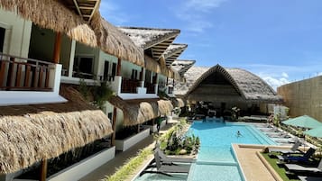 Outdoor pool, open 7:00 AM to 9:00 PM, pool umbrellas, pool loungers