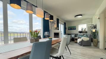 Townhome | Living area | Flat-screen TV, fireplace, heated floors