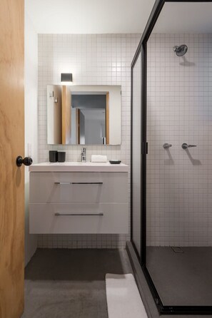 Shower, hair dryer, towels, shampoo
