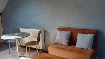 Classic Double Room | Living area | 30-cm flat-screen TV with cable channels, TV