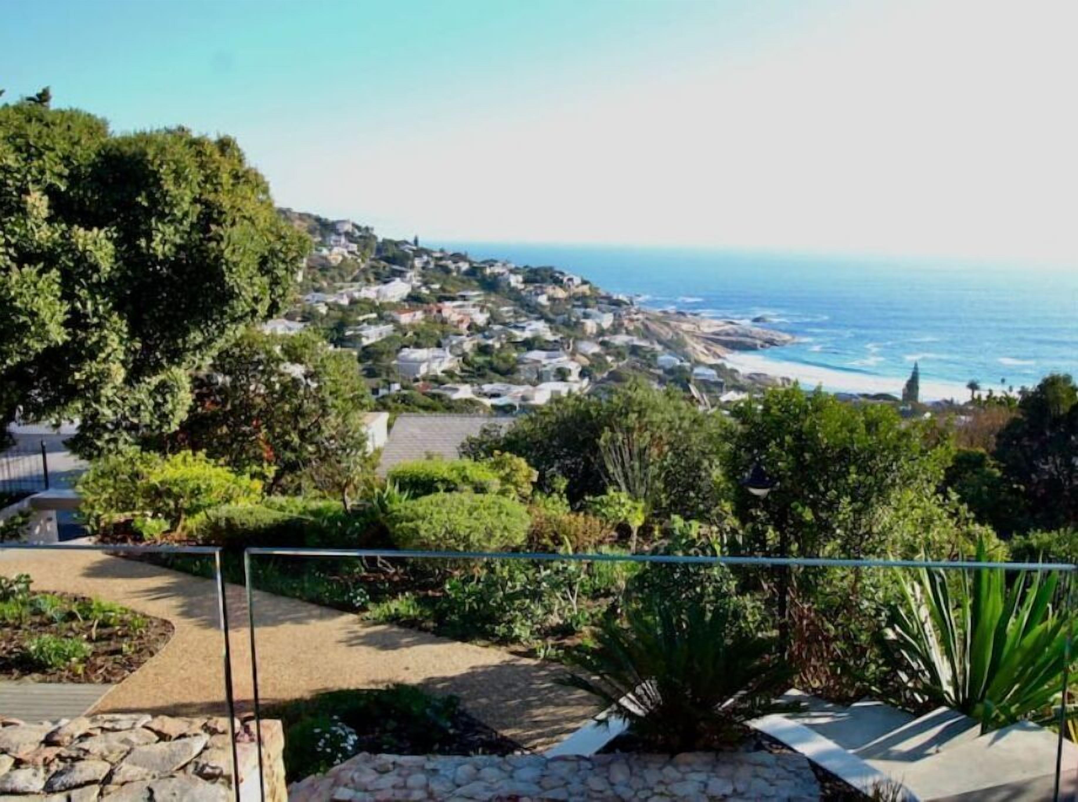 A coastal town with houses and a beach.