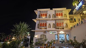 A multi-story hotel with traditional architectural design, featuring balconies with ornate railings and a signboard for 'treebo trend Kharkhri Haveli'. - Treebo Khakhri Haveli (Udaipur)