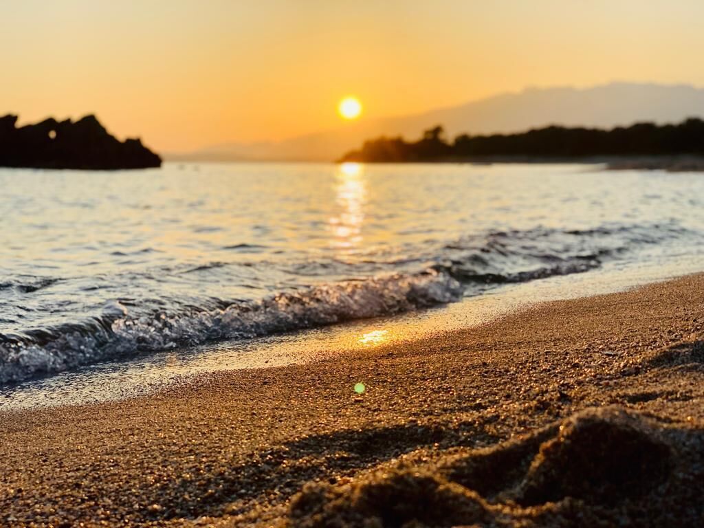 On the beach, sun-loungers