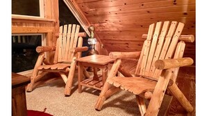 A wooden cabin with two Adirondack chairs and a small table. - Rustic Log Cabin By Bryce Resort XL Game Room Fire Pit Pets Friendly & More (Mount Jackson)