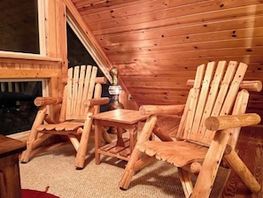 A wooden cabin with two Adirondack chairs and a small table. - Rustic Log Cabin By Bryce Resort XL Game Room Fire Pit Pets Friendly & More (Mount Jackson)