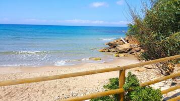 On the beach, sun loungers, beach towels