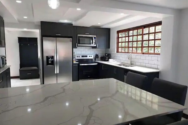 Laundry room, pantry and a country bench complement this kitchen.