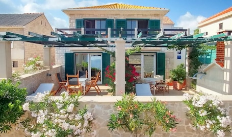 Outdoor dining. Apartments Gracin - Premium One Bedroom Apartment with Terrace