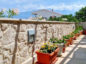 Enjoy the serene views of the surrounding mountains from this outdoor space.