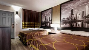 A hotel room with two beds, a cityscape view, and a door with a light above it.