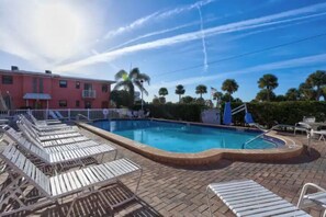A heated pool - Beach Escape - 2 Bedroom Condo, steps to the beach. (St. Pete Beach)
